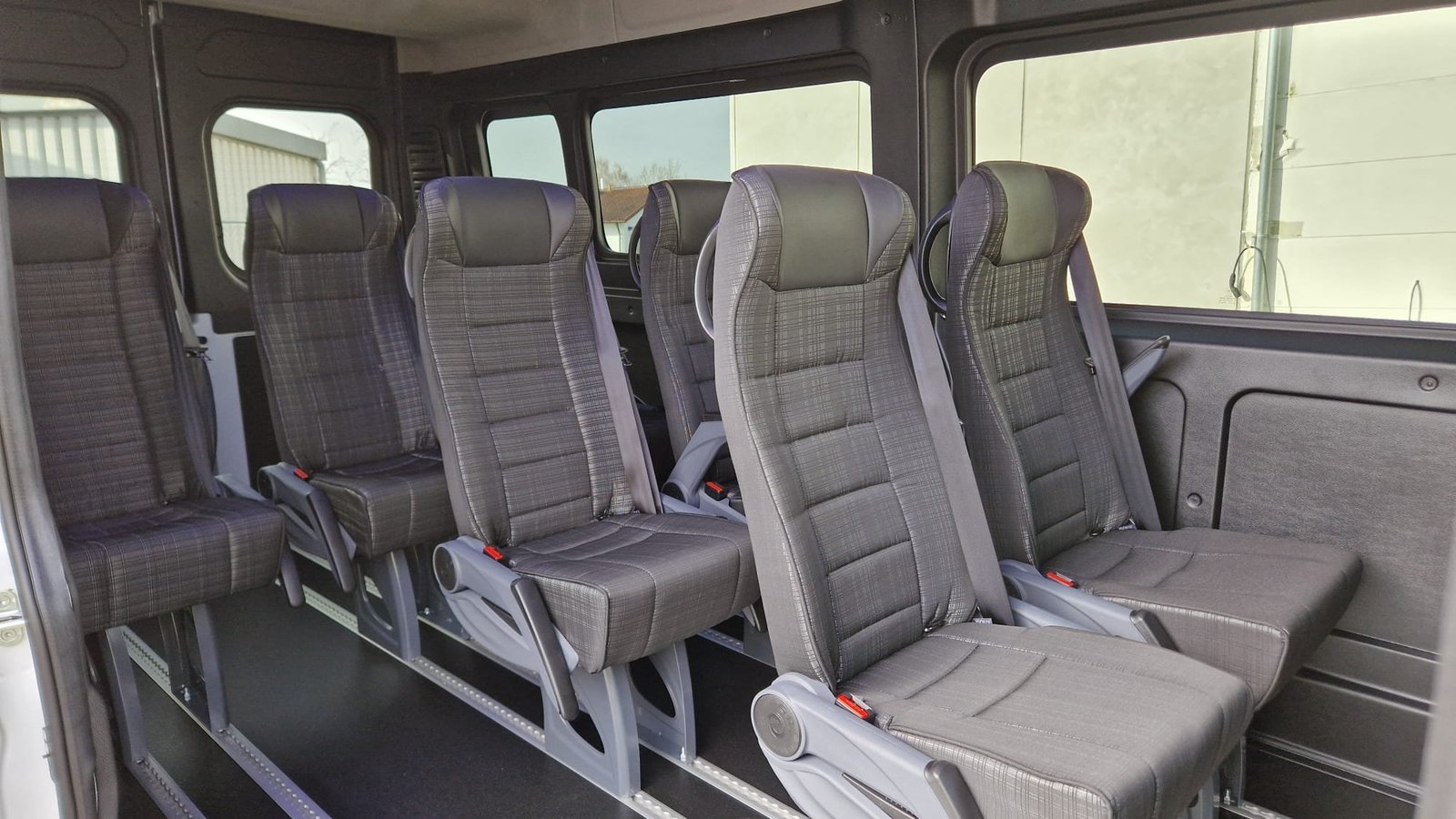 Interior of our 2026 Fiat Ducato 9-seater (Reg. OM3899), comfortable seating for up to 8 passengers