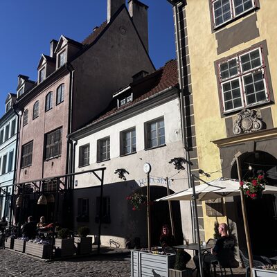 The Konventa Sēta cluster of medieval houses with cafés on Kalēju iela in afternoon light, Riga, Latvia
