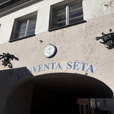 The Holy Spirit dove on the keystone above the Konventa Sēta entrance arch, Riga, Latvia