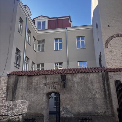 The back gate of Konventa Sēta from Skārņu iela, with the gothic-script sign, Riga, Latvia