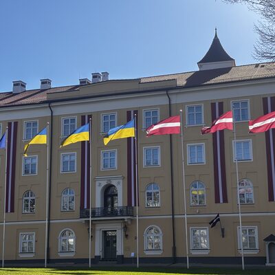 Eastern wing of Riga Castle with Latvian and Ukrainian flags, Riga, Latvia