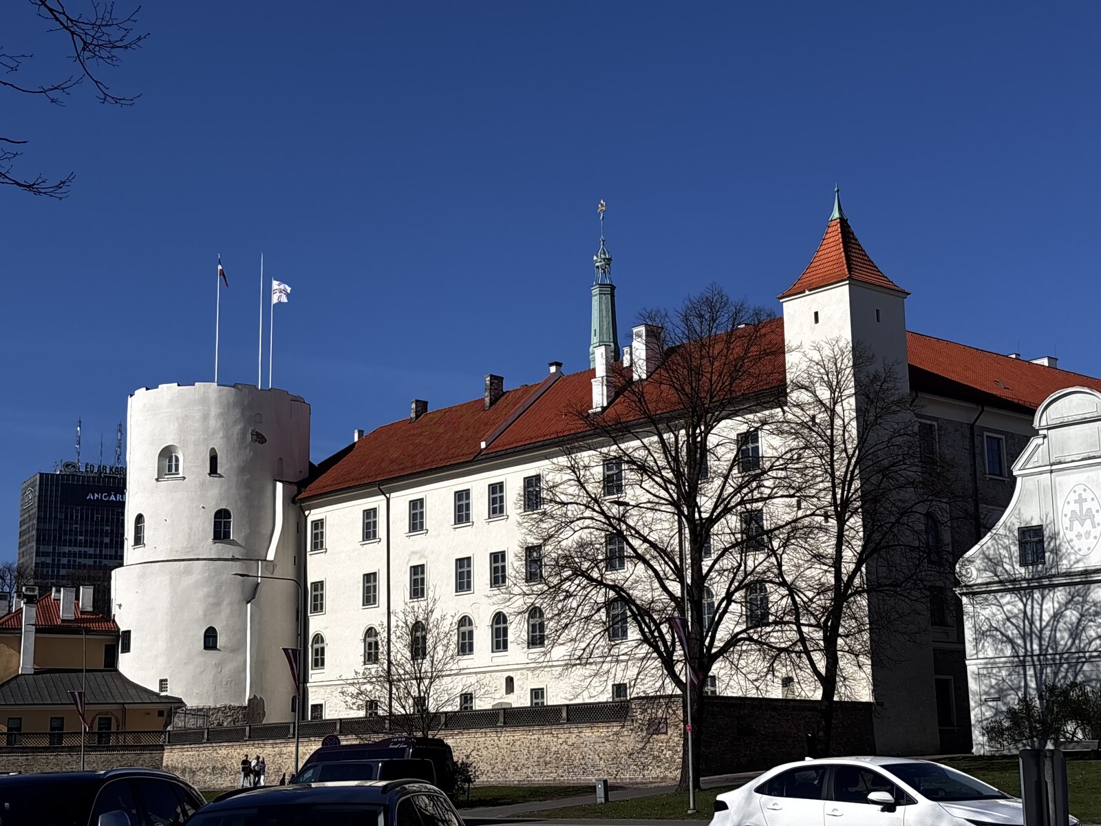 Riga Castle with white walls and the round Holy Spirit Tower, Riga, Latvia