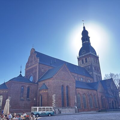 Vintage tour bus on Doma laukums in front of Riga Cathedral, Latvia