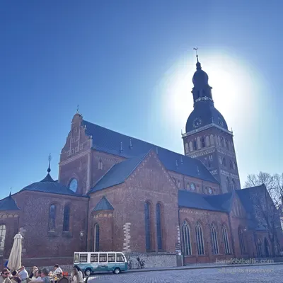 Vintage tour bus on Doma laukums in front of Riga Cathedral, Latvia