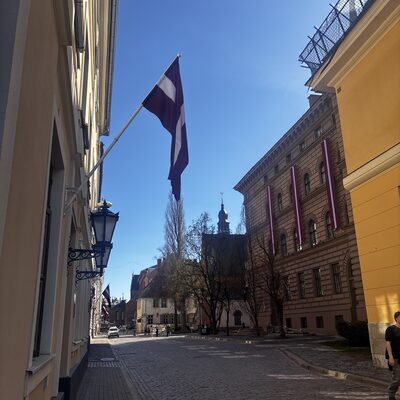 Jēkaba iela cobblestones with Saeima and St James's spire ahead, Riga, Latvia