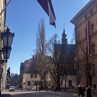 The Saeima with a Latvian flag, looking down Jēkaba iela toward St James's, Riga, Latvia