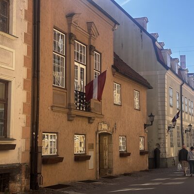Old houses on Torņa iela with a Latvian flag, near the Swedish Gate, Riga, Latvia