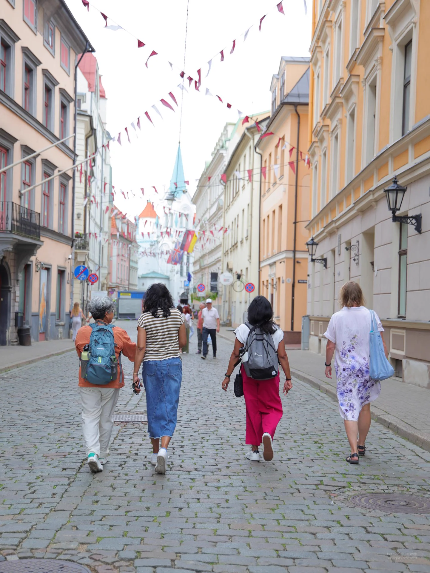 Guide and guests in Riga Old Town