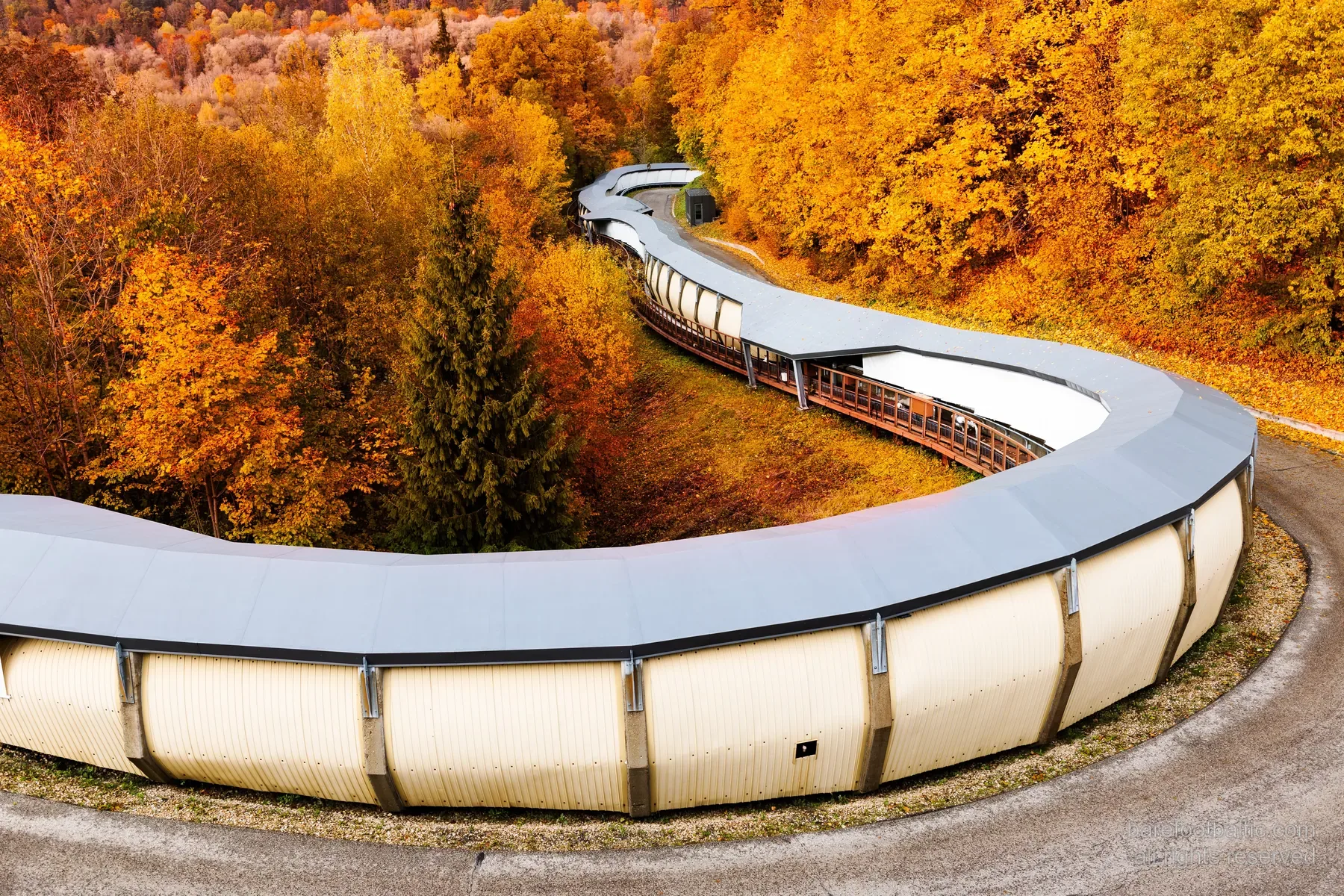 The Sigulda Olympic bobsleigh track winding through the autumn forest